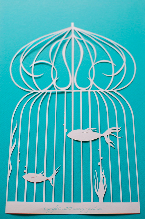 Sinemage Papercut fish in bird cage